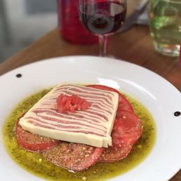 Mille-feuille of prosciutto and mozzarella, onion soup, pork fillet with caramelized apples, thick cut steak.