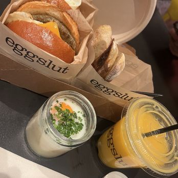 Eggslut - Bacon eggs & cheese Sandwich, sausage egg & cheese sandwich, the slut, and and OJ - Breakfast & Brunch Near Me - Las Vegas, Nevada