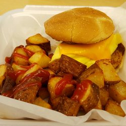 A Flying Sausage - Breakfast sandwich with home fries.