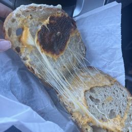 Burned cheese on ungrilled grilled cheese sandwich.