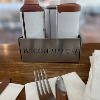 Bacon Bitch - a fork and knife on a table - Sandwiches Near Me - Miami Beach, Florida Bacon Bitch - a fork and knife on a table - Sandwiches Near Me - Miami Beach, Florida