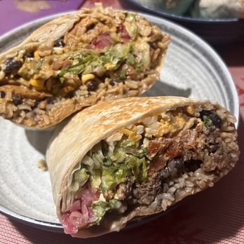 Quesada Burritos & Tacos - Half of a big ass chicken burrito, half a beef big ass burrito. - Mexican Near Me - Surrey, British Columbia Quesada Burritos & Tacos - Half of a big ass chicken burrito, half a beef big ass burrito. - Mexican Near Me - Surrey, British Columbia