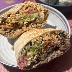 Quesada Burritos & Tacos - Half of a big ass chicken burrito, half a beef big ass burrito.