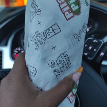 Pita Pit - a person holding a piece of food in their hand - Sandwiches Near Me - Orangeville, Ontario Pita Pit - a person holding a piece of food in their hand - Sandwiches Near Me - Orangeville, Ontario