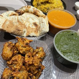 Vegetable Pakora 22. Garlic Naan CHICKEN TIKKA 18. Goat Biryani Special PALAK PANEER Vegetable Pakora 22. Garlic Naan CHICKEN TIKKA 18. Goat Biryani Special PALAK PANEER