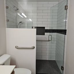 a bathroom with a shower and toilet
