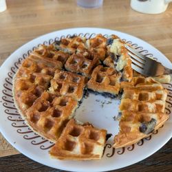 Waffle House - Blueberry waffle cut and portion with a piece taken out for an example.