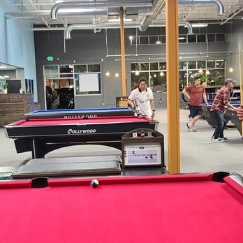 Cafe Billiards - a man standing in front of a pool table - Pool Halls Near Me - Lynnwood, Washington Cafe Billiards - a man standing in front of a pool table - Pool Halls Near Me - Lynnwood, Washington