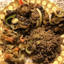 Family Taste - Oxtail, dirty rice, and cabbage! Delicious!