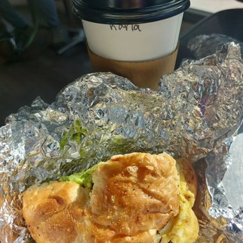 Higher Grounds Coffee House - hot oatmilk caramel macchiato & a sliced sausage, egg, cheese & avocado everything bagel sandwhich - Coffee & Tea Near Me - Crestline, California Higher Grounds Coffee House - hot oatmilk caramel macchiato & a sliced sausage, egg, cheese & avocado everything bagel sandwhich - Coffee & Tea Near Me - Crestline, California