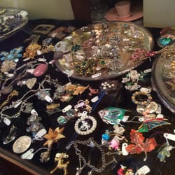 Lots of shiny costume jewelry by renown makers. Necklaces, earrings, suites, and brooches in nearly every color.