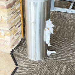 This trash can has officially entered its "I can't do this anymore" era.