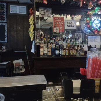 Side Street Saloon - a bar with a lot of bottles of liquor - Dive Bars Near Me - Chicago, Illinois Side Street Saloon - a bar with a lot of bottles of liquor - Dive Bars Near Me - Chicago, Illinois
