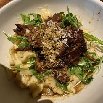 North Italia - BRAISED SHORT RIB LUMACHE parmesan fonduta, fresh horseradish, wilted arugula, herb breadcrumb - Italian Near Me - Birmingham, Alabama North Italia - BRAISED SHORT RIB LUMACHE parmesan fonduta, fresh horseradish, wilted arugula, herb breadcrumb - Italian Near Me - Birmingham, Alabama
