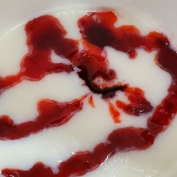 Sip City Daiquiris - Pina colada with strawberry drip - Cocktail Bars Near Me - Houston, Texas