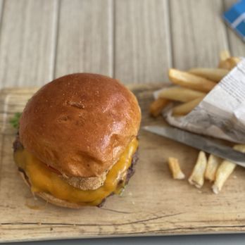 Coral Reef Bar and Grill - Shipwreck Burger with American Cheese - American Near Me - Orlando, Florida Coral Reef Bar and Grill - Shipwreck Burger with American Cheese - American Near Me - Orlando, Florida