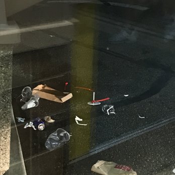 McDonald's - trash on the ground outside of a store window - Burgers Near Me - St. Clairsville, Ohio