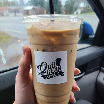 Quil Bean Espresso - a hand holding a cup of coffee - Coffee & Tea Near Me - Quilcene, Washington