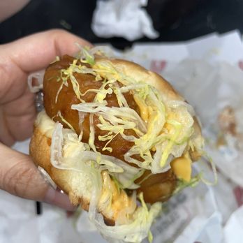 Savvy Sliders - a person holding a hot dog - Chicken Wings Near Me - Madison Heights, Michigan Savvy Sliders - a person holding a hot dog - Chicken Wings Near Me - Madison Heights, Michigan