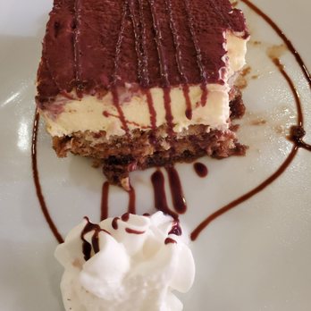 Alforno's Italian Kitchen - Tiramisu (some bites missing) - Italian Near Me - Flower Mound, Texas Alforno's Italian Kitchen - Tiramisu (some bites missing) - Italian Near Me - Flower Mound, Texas