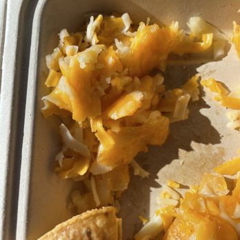 Islands Restaurant - Unmelted cheese on Nachos chips - Burgers Near Me - Pasadena, California