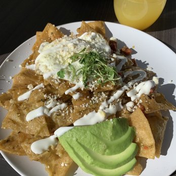 Heirloom Craft Kitchen - Chilaquiles w/ a lil Mimosa in the Background - New American Near Me - Indio, California Heirloom Craft Kitchen - Chilaquiles w/ a lil Mimosa in the Background - New American Near Me - Indio, California