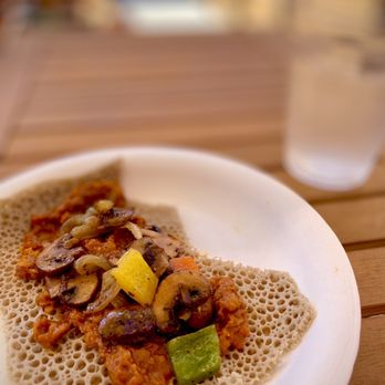Ebony - Half order: Spicy Misir Wot + Enguday Tibs on a bed of Injura. - Ethiopian Near Me - San Luis Obispo, California