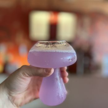 Mahall's - a hand holding a purple object - Bowling Near Me - Lakewood, Ohio