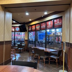 Boston's Pizza Restaurant & Sports Bar - Inside, you can see the water park through the glass