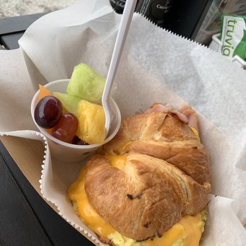 The Sticky Bun - Croissant with egg, cheese, ham, and a side of fruit - Breakfast & Brunch Near Me - Deerfield Beach, Florida
