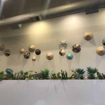 Forever Pho - a variety of decorative objects on a wall - Vietnamese Near Me - Allen, Texas