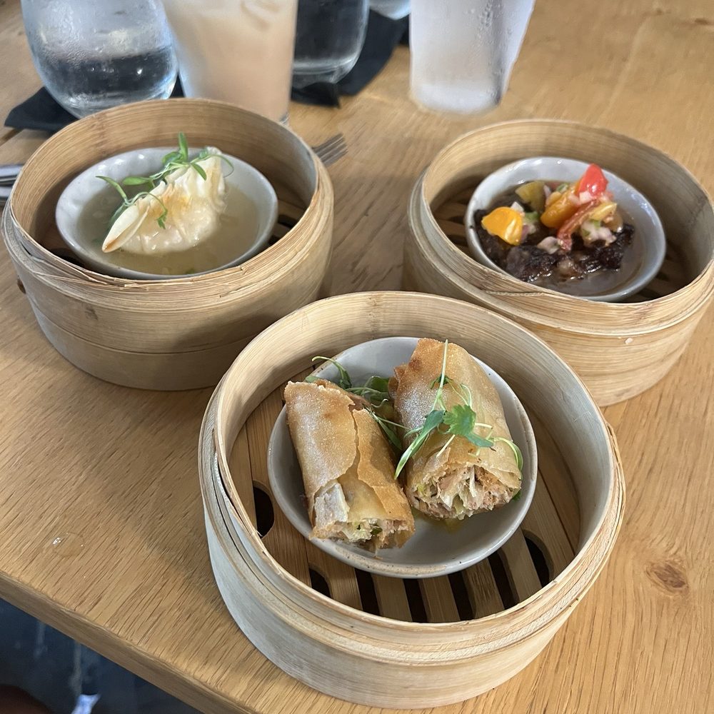 Piko Kitchen + Bar - Pupu sampler; kalua pig spring roll, pipikaula with poi and lomi tomato, chicken long rice dumplings - Cocktail Bars Near Me - Honolulu, Hawaii