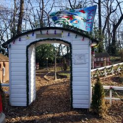 Tiny World - Entrance. Donation box inside this small structure. Please leave a small offering to keep the Christmas lights on.