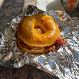 a bagel sandwich wrapped in foil