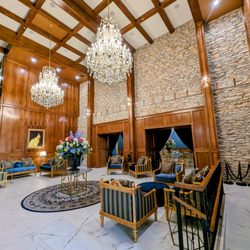 PA Smith Hotel - Step into elegance beneath grand chandeliers in our breathtaking lobby where Texas charm meets timeless sophistication.