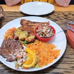 Casa Calaca - The Casa Especial. Grilled steak, chicken and bacon-wrapped shrimp with all the trimmings.