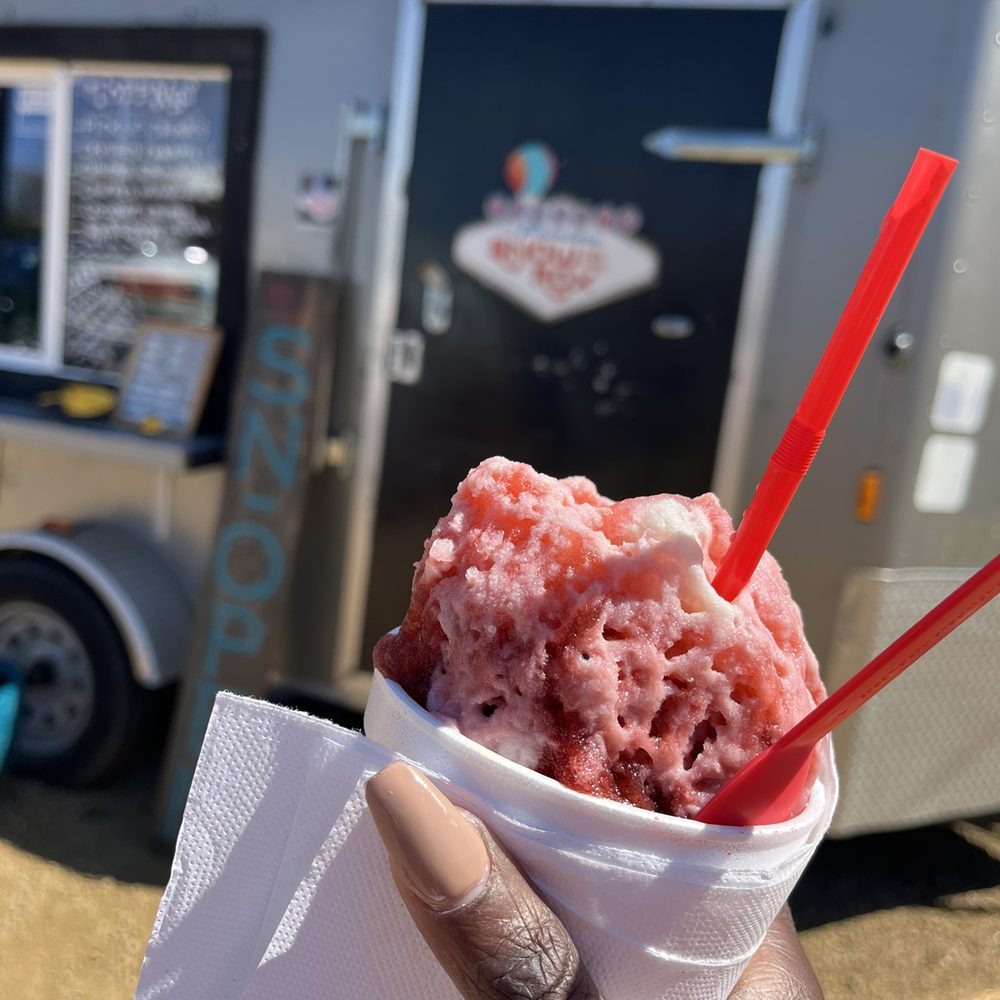 Snow On The Rox - a hand holding a cup of ice cream - Shaved Snow Near Me - DeSoto, Texas