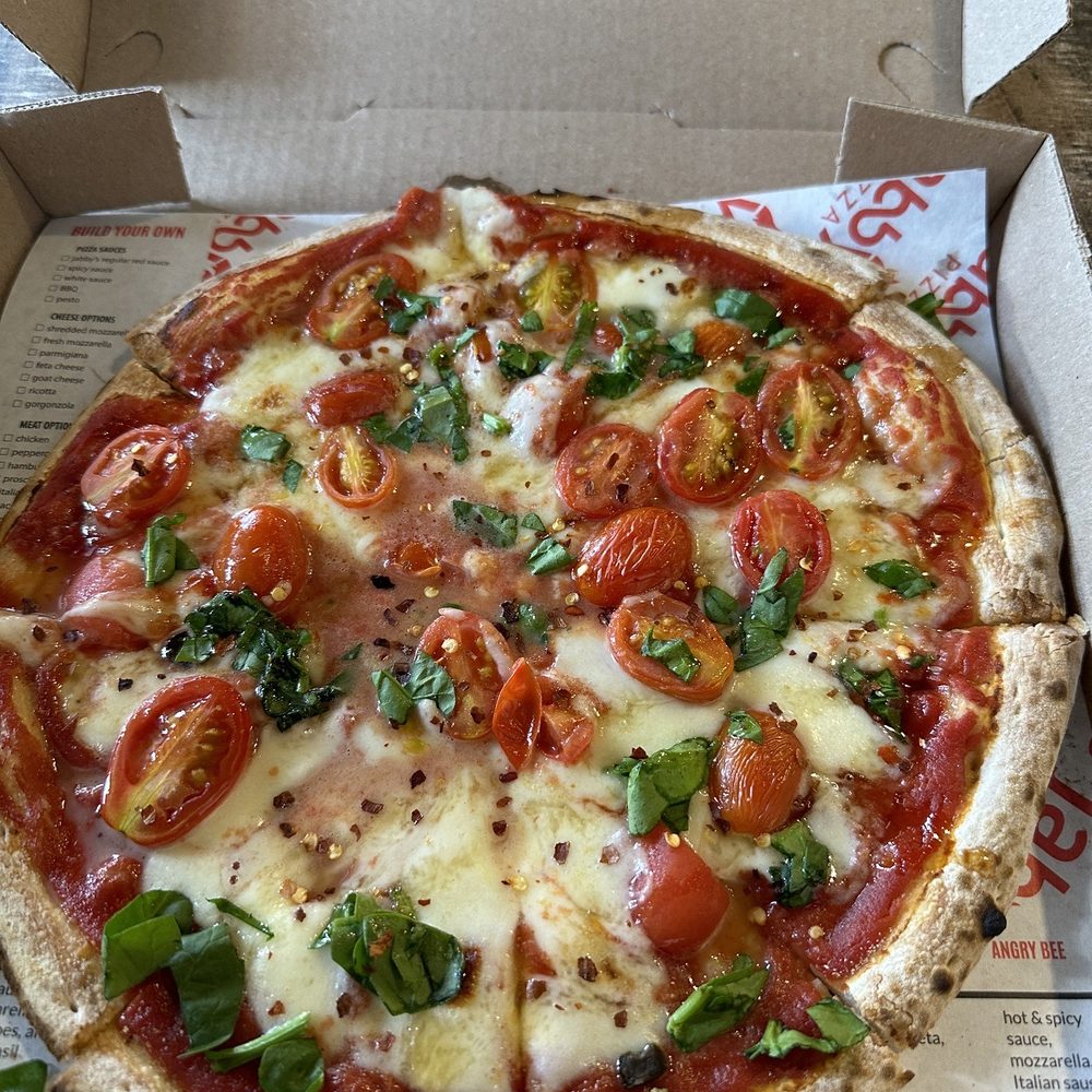 Margherita Pizza with spinach & sweet honey sauce Margherita Pizza with spinach & sweet honey sauce