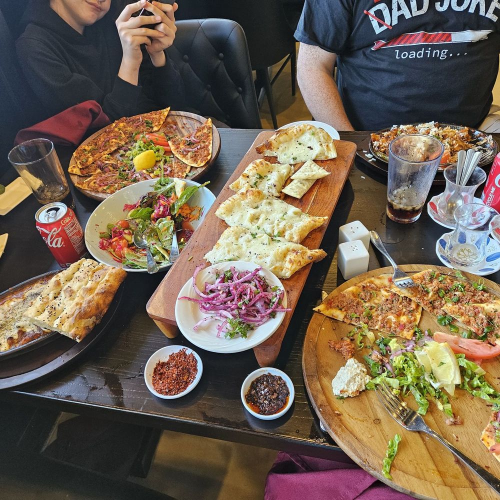 Top L-R, Lahmacun, Salad, Pide, Iskender Bottom L-R Eaten Mezze Platter, Chicken Tava, sumac onions, extra spices, Lahmacun. Top L-R, Lahmacun, Salad, Pide, Iskender Bottom L-R Eaten Mezze Platter, Chicken Tava, sumac onions, extra spices, Lahmacun.