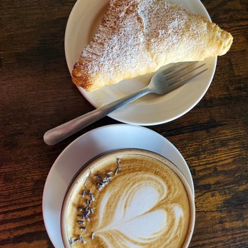The Sacred Bean - Lemon filled pastry with lavender white mocha - Coffee & Tea Near Me - Pueblo, Colorado The Sacred Bean - Lemon filled pastry with lavender white mocha - Coffee & Tea Near Me - Pueblo, Colorado