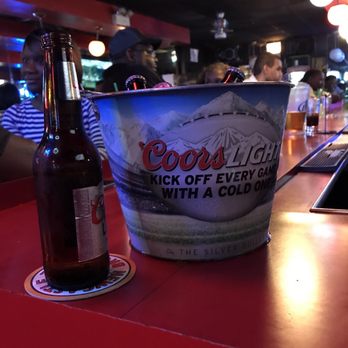Red Pepper - a bucket of beer and a bottle on a bar - Lounges Near Me - Chicago, Illinois Red Pepper - a bucket of beer and a bottle on a bar - Lounges Near Me - Chicago, Illinois