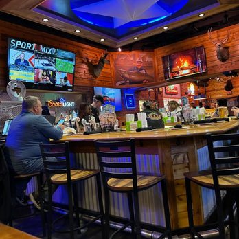 Texas Roadhouse - a man sitting at the bar - Steakhouses Near Me - Oak Creek, Wisconsin Texas Roadhouse - a man sitting at the bar - Steakhouses Near Me - Oak Creek, Wisconsin