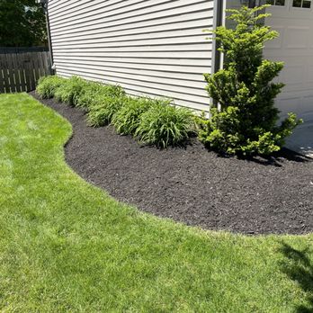Green Line Landscape - a black mulch bed in front of a house - Landscaping Near Me Green Line Landscape - a black mulch bed in front of a house - Landscaping Near Me