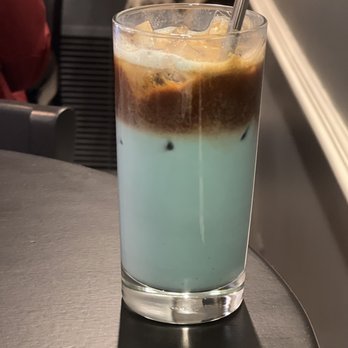 Botanical Fare - a glass of iced coffee on a table - Vegan Near Me - Charlottesville, Virginia