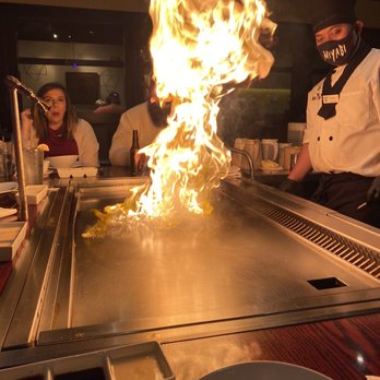 Miyabi - a chef cooking food on a grill - Japanese Near Me - Savannah, Georgia Miyabi - a chef cooking food on a grill - Japanese Near Me - Savannah, Georgia