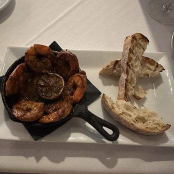 Savour - Cast Iron BBQ Gulf Shrimp in a nice spicy tomato based sauce. Bread for dipping. - New American Near Me - Tallahassee, Florida Savour - Cast Iron BBQ Gulf Shrimp in a nice spicy tomato based sauce. Bread for dipping. - New American Near Me - Tallahassee, Florida