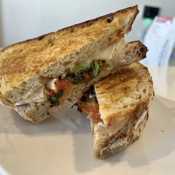 Switchback Coffee Roasters - Brie & Sweet Basil Sandwich -- Melted French brie cheese, blistered cherry tomatoes, fresh basil, crushed red peppers and wildflower honey - Coffee & Tea Near Me - Colorado Springs, Colorado Switchback Coffee Roasters - Brie & Sweet Basil Sandwich -- Melted French brie cheese, blistered cherry tomatoes, fresh basil, crushed red peppers and wildflower honey - Coffee & Tea Near Me - Colorado Springs, Colorado