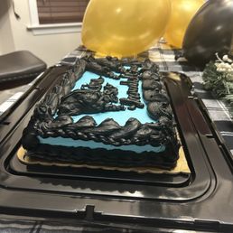 a birthday cake with blue frosting