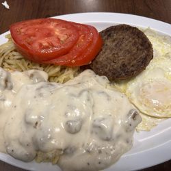 Decatur TN Family Diner - Biscuits and gravy, sausage patty over easy, eggs, hashbrowns, and two beautiful slices of tomato. Excellent breakfast all under 9.00!