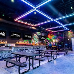 Asylum Bar + Arcade - Asylum Arcade + Bar offers a variety of pinball, arcade games, and board games for all interests.